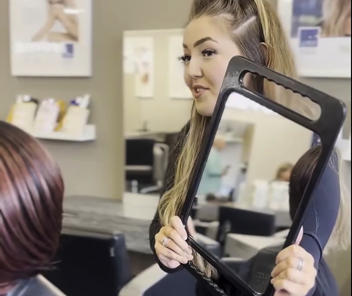 hair stylist with satisfied customer